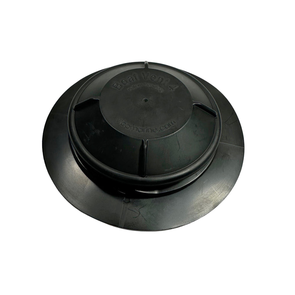 Black plastic drain cover on a white background